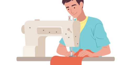 Man working on sewing machine Man working on sewing machine